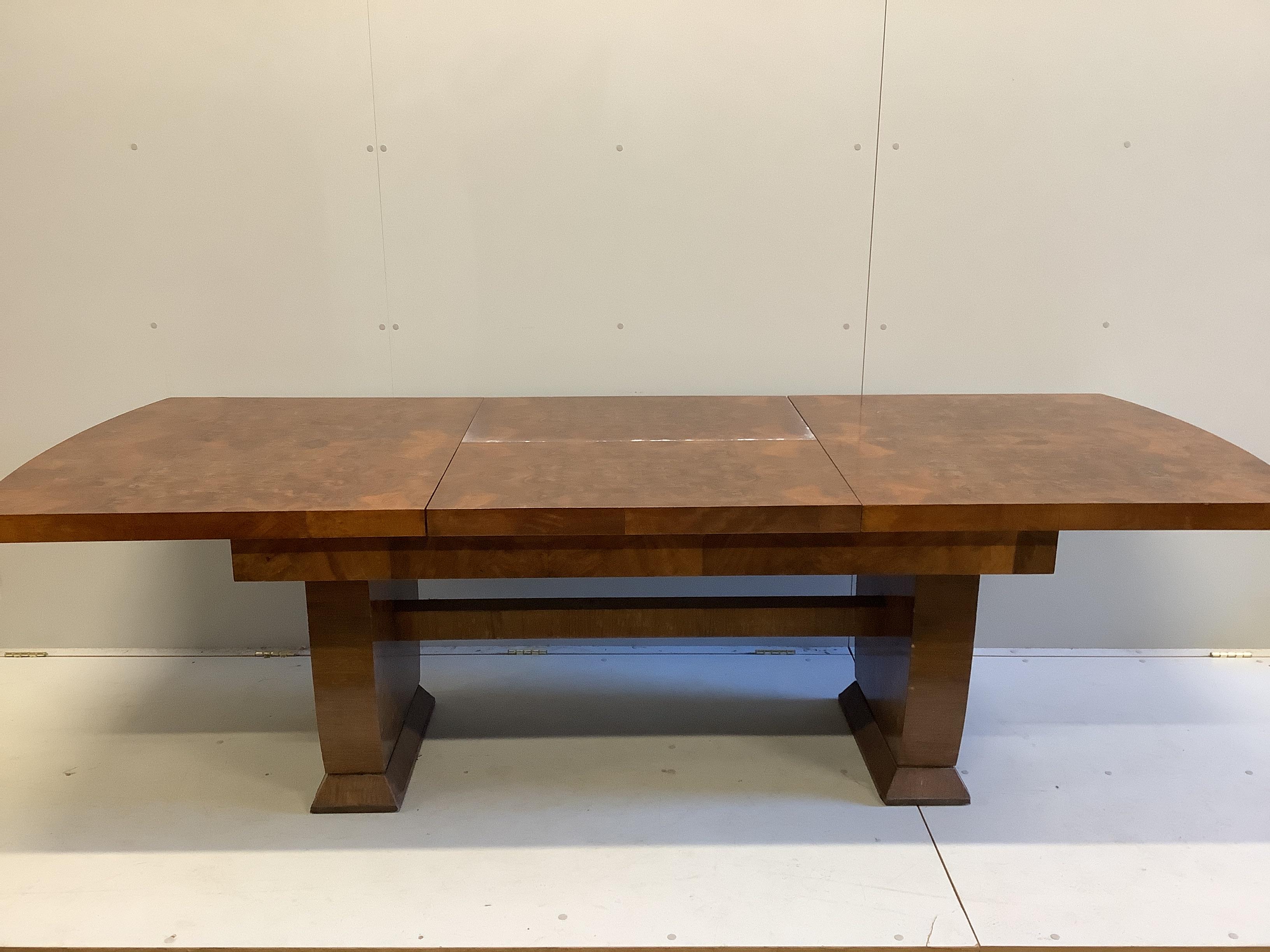 An Art Deco style walnut extending dining table, width 170cm, depth 92cm, height 73cm
